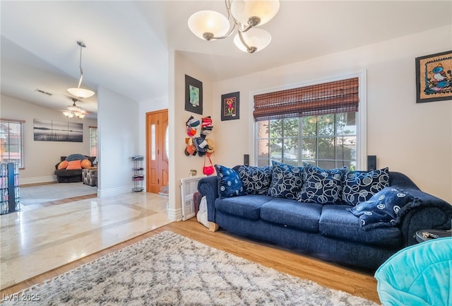 7517 Elk Meadows Ct, Las Vegas, NV 89131 - living area featuring a chandelier, healthy amount of natural light, and wood finished floors