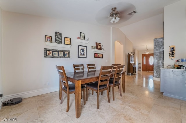 7517 Elk Meadows Ct, Las Vegas, NV 89131 - dining room featuring arched walkways, a ceiling fan, and vaulted ceiling