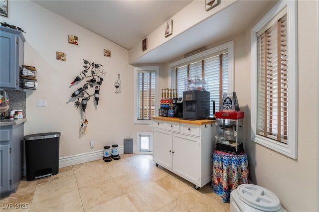 7517 Elk Meadows Ct, Las Vegas, NV 89131 - kitchen with light tile patterned floors and butcher block counters