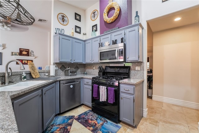 7517 Elk Meadows Ct, Las Vegas, NV 89131 - kitchen featuring appliances with stainless steel finishes, backsplash, a high ceiling, light tile patterned flooring, and light stone countertops