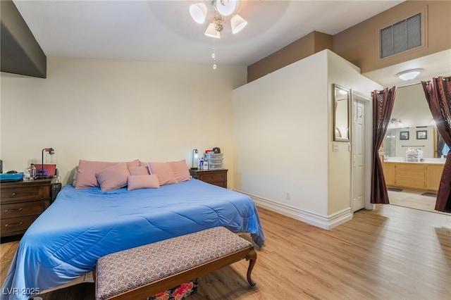 7517 Elk Meadows Ct, Las Vegas, NV 89131 - bedroom featuring light wood-style flooring, ensuite bath, and ceiling fan
