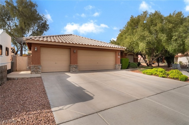 7517 Elk Meadows Ct, Las Vegas, NV 89131 - view of front of home featuring stone siding, stucco siding, a tile roof, and driveway
