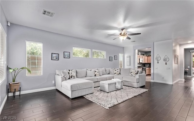 3005 Dotted Wren Ave, North Las Vegas, NV 89084 - living area with dark wood-type flooring and a ceiling fan