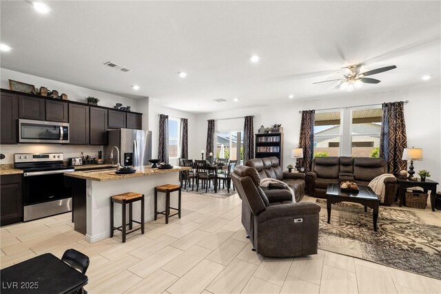 3568 E Malheur Ave, Pahrump, NV 89061 - living area with a ceiling fan and recessed lighting