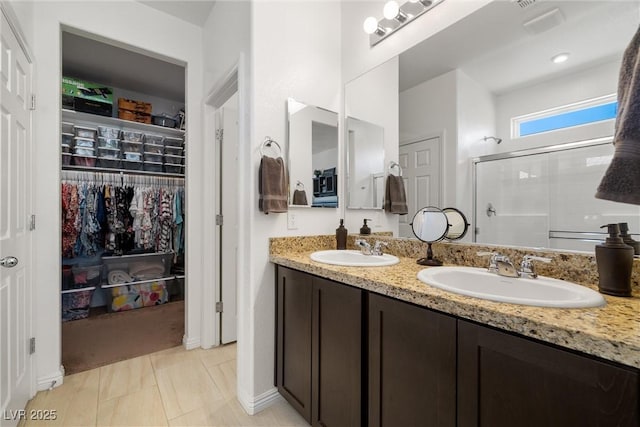 3568 E Malheur Ave, Pahrump, NV 89061 - bathroom with a stall shower, double vanity, and a walk in closet