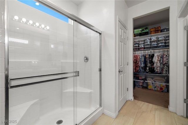 3568 E Malheur Ave, Pahrump, NV 89061 - bathroom with a stall shower and a walk in closet