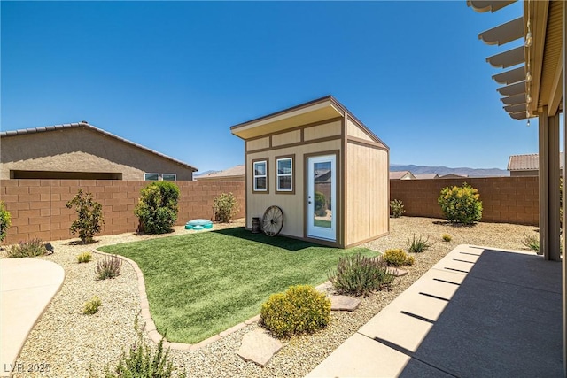3568 E Malheur Ave, Pahrump, NV 89061 - fenced backyard with an outbuilding and a patio area