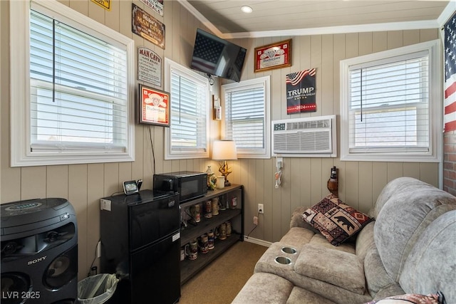 3568 E Malheur Ave, Pahrump, NV 89061 - sitting room featuring crown molding, carpet flooring, an AC wall unit, healthy amount of natural light, and wooden walls