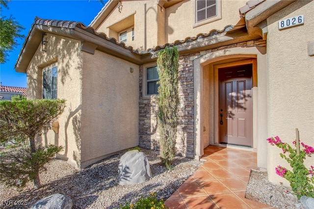 8026 Sunset Creek St, Las Vegas, NV 89113 - property entrance featuring stone siding and stucco siding