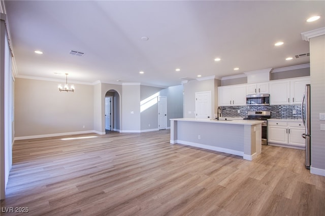 8026 Sunset Creek St, Las Vegas, NV 89113 - kitchen featuring stainless steel appliances, ornamental molding, white cabinets, open floor plan, and backsplash