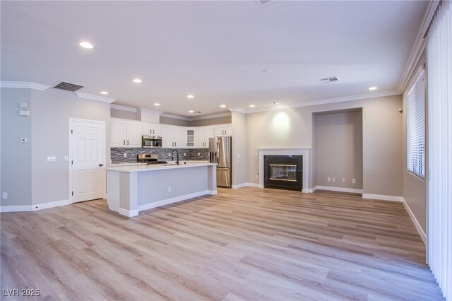 8026 Sunset Creek St, Las Vegas, NV 89113 - kitchen with appliances with stainless steel finishes, ornamental molding, recessed lighting, decorative backsplash, and white cabinets