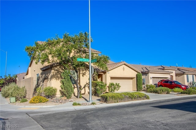 8026 Sunset Creek St, Las Vegas, NV 89113 - view of front of house featuring a garage, stucco siding, a tiled roof, and concrete driveway