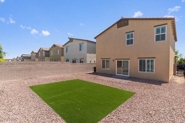 4498 Lantern Point Ave, North Las Vegas, NV 89084 - rear view of house featuring a fenced backyard and stucco siding
