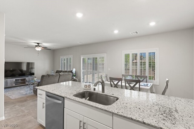4498 Lantern Point Ave, North Las Vegas, NV 89084 - kitchen with dishwasher, recessed lighting, white cabinets, light stone countertops, and ceiling fan