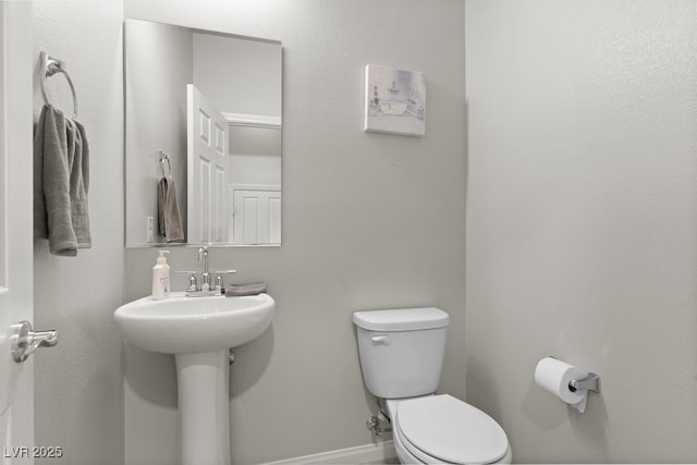 4498 Lantern Point Ave, North Las Vegas, NV 89084 - half bathroom featuring toilet and baseboards