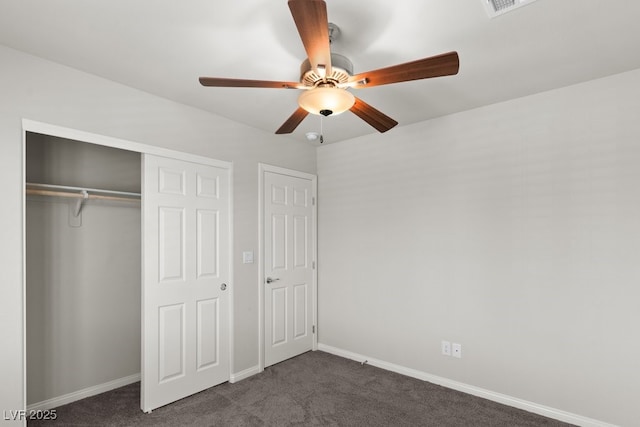 4498 Lantern Point Ave, North Las Vegas, NV 89084 - unfurnished bedroom with dark colored carpet, a closet, and a ceiling fan