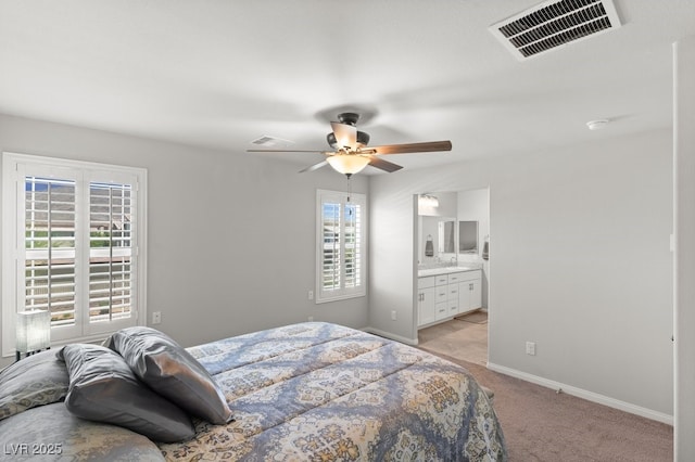 4498 Lantern Point Ave, North Las Vegas, NV 89084 - bedroom featuring light carpet, connected bathroom, and ceiling fan