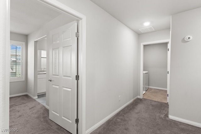 4498 Lantern Point Ave, North Las Vegas, NV 89084 - corridor with carpet and washer / clothes dryer