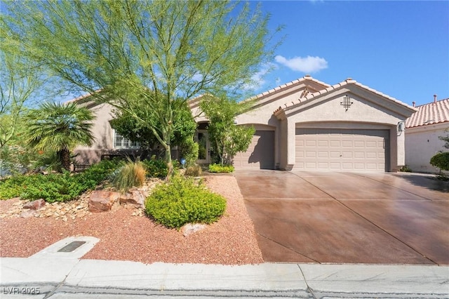 4014 Trapani Pl, Las Vegas, NV 89141 - view of front of house featuring an attached garage, stucco siding, driveway, and a tile roof