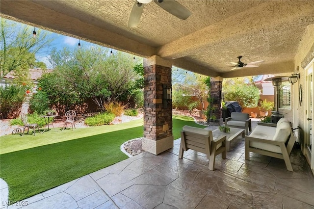 4014 Trapani Pl, Las Vegas, NV 89141 - fenced backyard with ceiling fan, a patio, and an outdoor hangout area