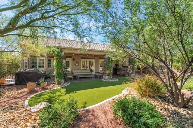 4014 Trapani Pl, Las Vegas, NV 89141 - rear view of property featuring french doors, stucco siding, a yard, and an outdoor hangout area