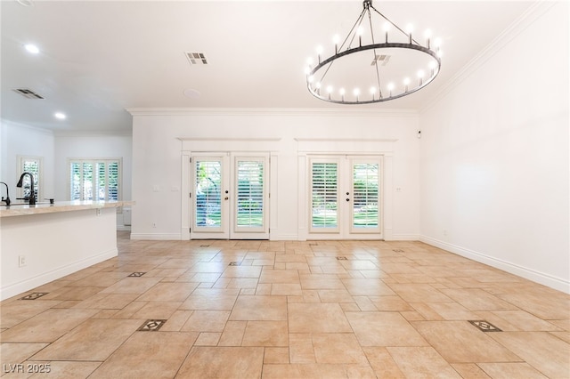 4014 Trapani Pl, Las Vegas, NV 89141 - unfurnished room with plenty of natural light, ornamental molding, a chandelier, light stone finish floors, and recessed lighting
