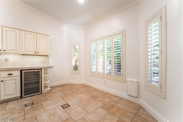 4014 Trapani Pl, Las Vegas, NV 89141 - indoor dry bar with beverage cooler, crown molding, and stone finish flooring