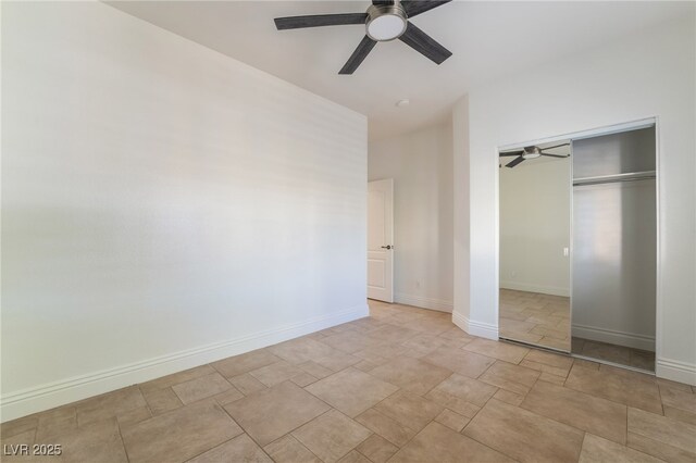 4014 Trapani Pl, Las Vegas, NV 89141 - unfurnished bedroom featuring a closet, stone finish flooring, and a ceiling fan