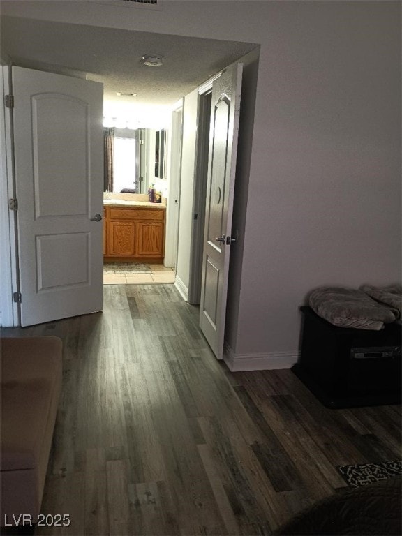 1515 E Reno Ave Unit D202, Las Vegas, NV 89119 - hallway featuring wood finished floors
