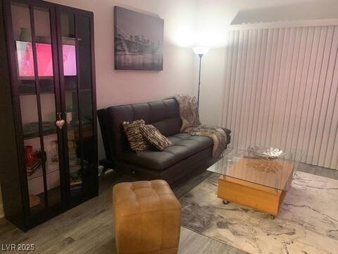 1515 E Reno Ave Unit D202, Las Vegas, NV 89119 - living area with wood finished floors