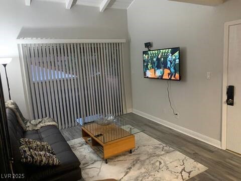 1515 E Reno Ave Unit D202, Las Vegas, NV 89119 - living room featuring wood finished floors and beam ceiling