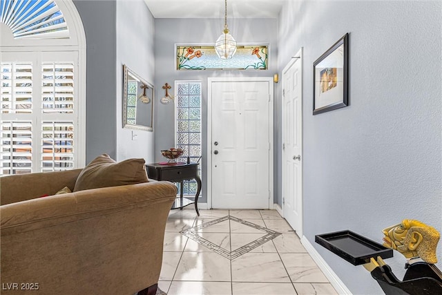 2042 Maple Springs St, Henderson, NV 89002 - foyer featuring baseboards and light marble finish flooring