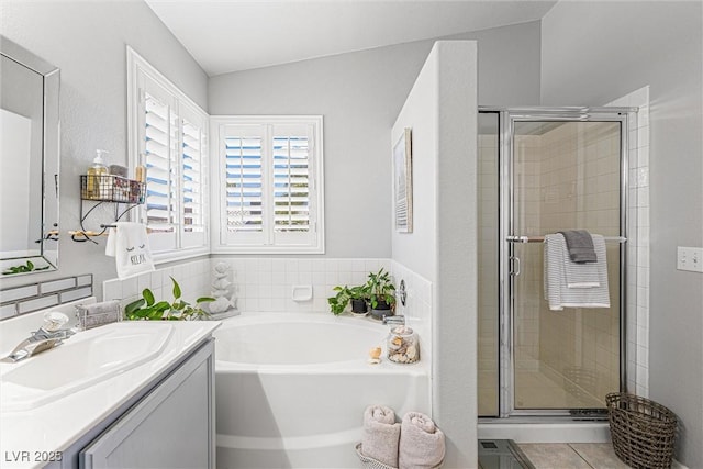 2042 Maple Springs St, Henderson, NV 89002 - full bath featuring vanity, a garden tub, a stall shower, tile patterned floors, and lofted ceiling