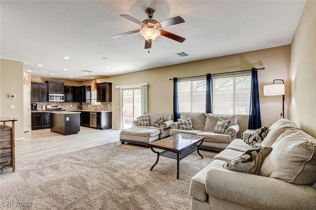 6897 Linda Creek Ct, Las Vegas, NV 89178 - living area with ceiling fan, light colored carpet, and recessed lighting