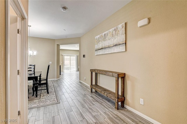 6897 Linda Creek Ct, Las Vegas, NV 89178 - hallway featuring light wood-style floors and baseboards