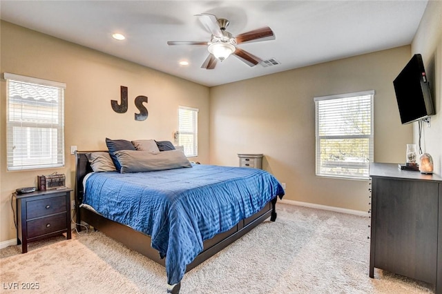 6897 Linda Creek Ct, Las Vegas, NV 89178 - bedroom featuring light colored carpet, multiple windows, recessed lighting, and ceiling fan