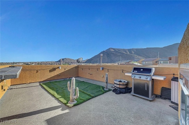 3908 Total Eclipse St, Las Vegas, NV 89129 - view of patio featuring area for grilling and a mountain view