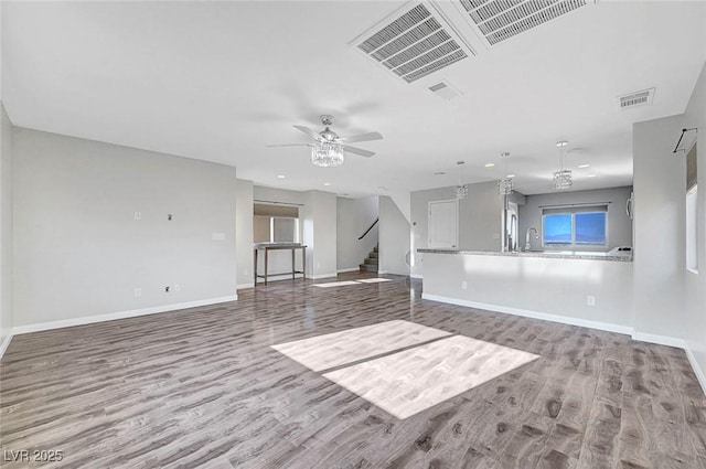 3908 Total Eclipse St, Las Vegas, NV 89129 - unfurnished living room featuring wood finished floors, stairway, recessed lighting, and a ceiling fan