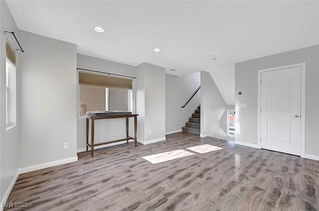 3908 Total Eclipse St, Las Vegas, NV 89129 - unfurnished living room featuring wood finished floors, stairs, and recessed lighting