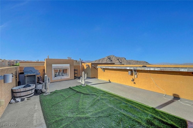 3908 Total Eclipse St, Las Vegas, NV 89129 - back of property with a patio area, a mountain view, and stucco siding