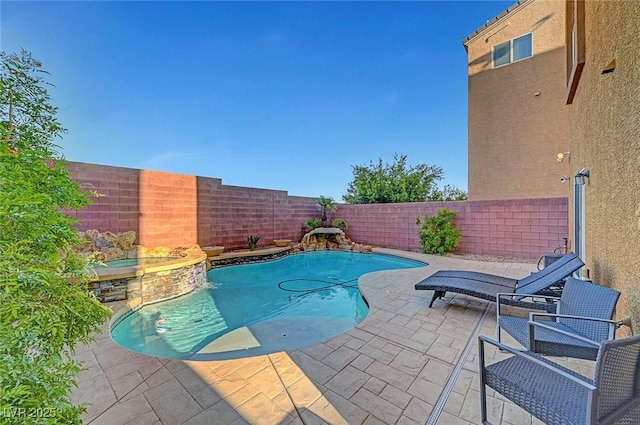 3908 Total Eclipse St, Las Vegas, NV 89129 - view of swimming pool featuring a fenced backyard, a patio area, and a pool with connected hot tub