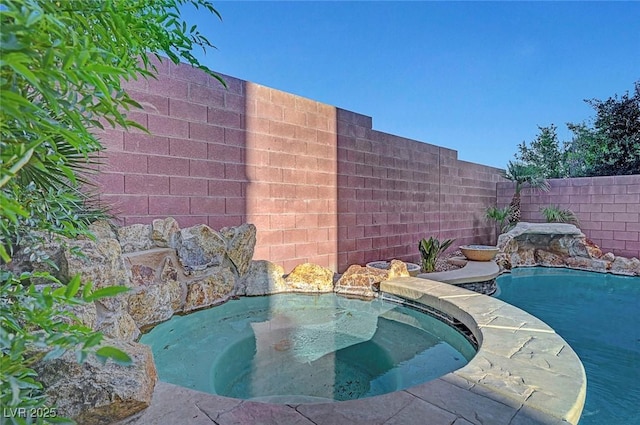 3908 Total Eclipse St, Las Vegas, NV 89129 - view of swimming pool with a fenced backyard and a pool with connected hot tub