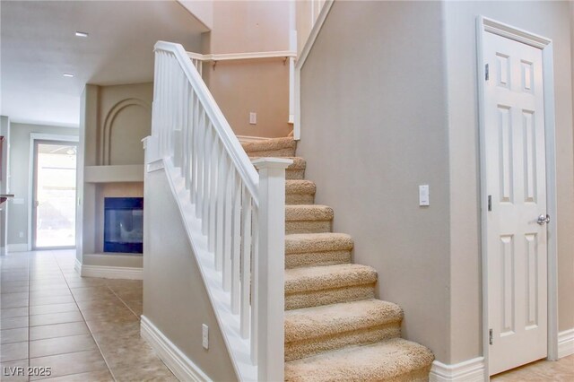 72 Broken Putter Way, Las Vegas, NV 89148 - staircase featuring tile patterned floors and baseboards