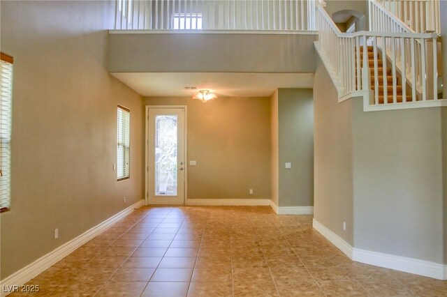 72 Broken Putter Way, Las Vegas, NV 89148 - tiled entrance foyer with a towering ceiling and stairway