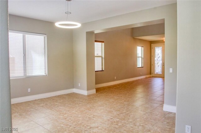 72 Broken Putter Way, Las Vegas, NV 89148 - empty room featuring light tile patterned flooring and baseboards