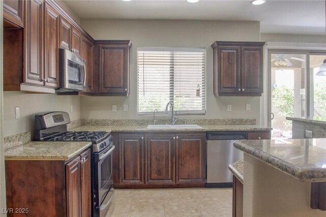 72 Broken Putter Way, Las Vegas, NV 89148 - kitchen with appliances with stainless steel finishes, recessed lighting, plenty of natural light, light tile patterned flooring, and ceiling fan