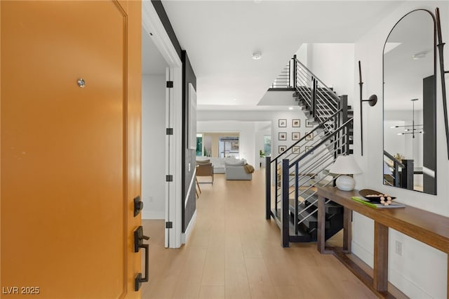 389 Red Feather Peak Ct, Las Vegas, NV 89138 - hall with stairway and light wood-style flooring