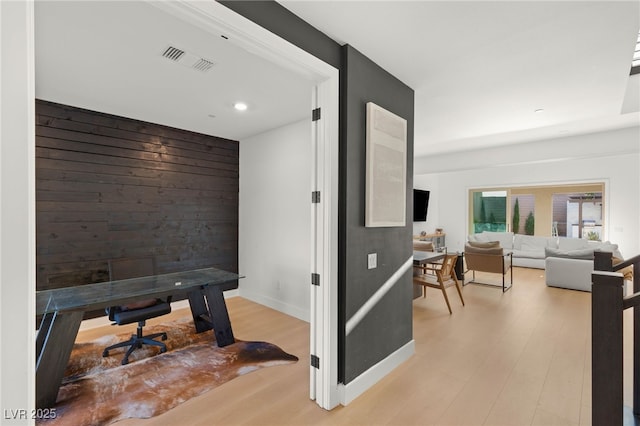 389 Red Feather Peak Ct, Las Vegas, NV 89138 - corridor with light wood-style floors, wooden walls, recessed lighting, and an office area