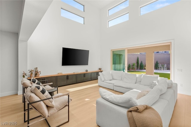 389 Red Feather Peak Ct, Las Vegas, NV 89138 - living area with light wood-type flooring and a high ceiling
