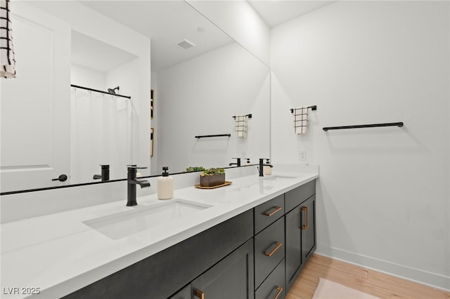 389 Red Feather Peak Ct, Las Vegas, NV 89138 - bathroom with double vanity and wood finished floors